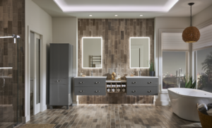 Contemporary bathroom with floating gray vanities, illuminated mirrors, wood-look tile walls, and a built-in storage center.