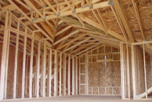 Interior framing of master bedroom suite with high vaulted ceiling