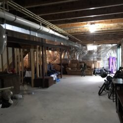 Open unfinished basement before remodeling and finishing work in Westminster MD by Merrell Building.